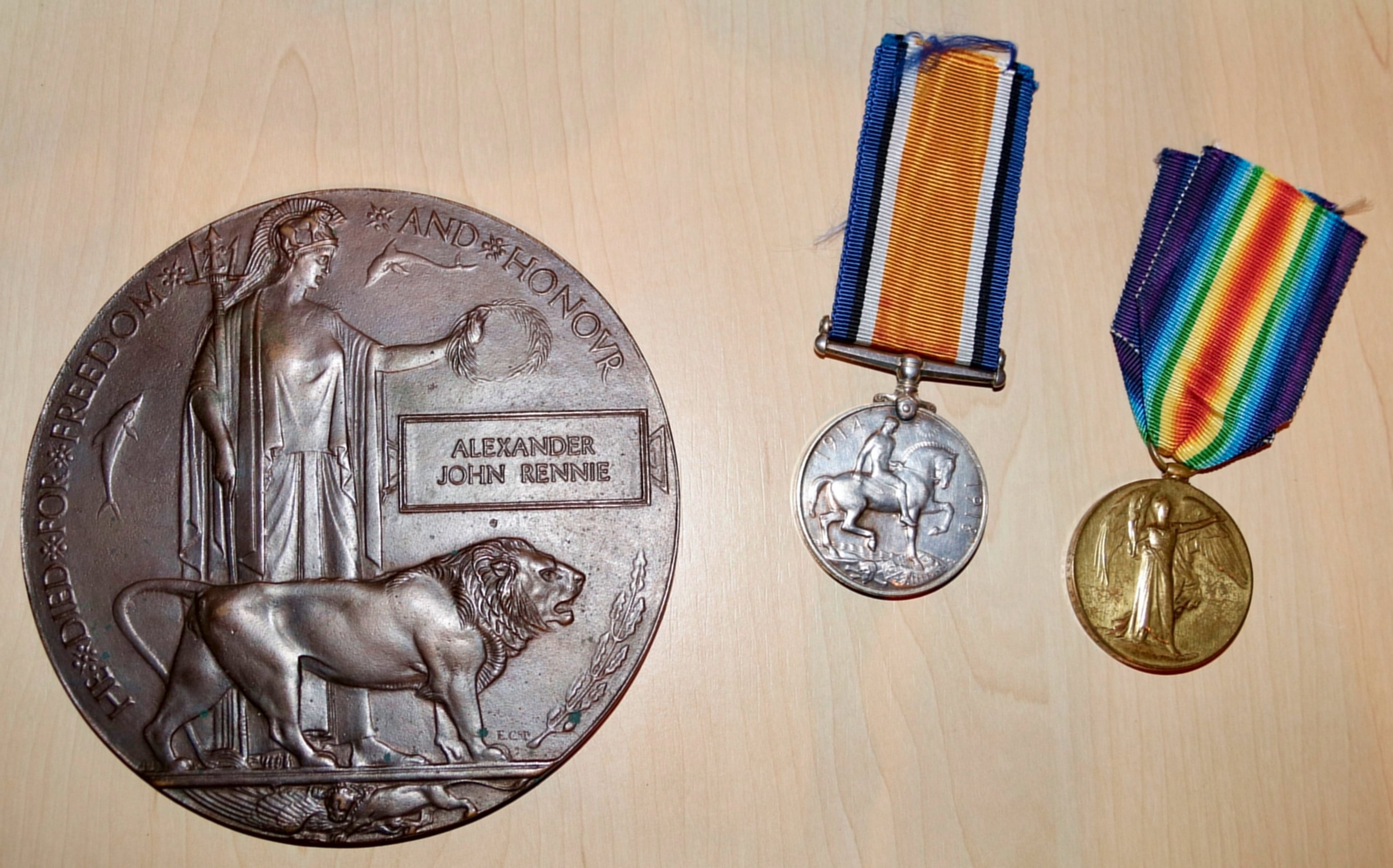 [Alexander Rennie's memorial plaque and medals]
